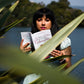 Holding book, I Write Letters in my Thoughts,  at Lake Merritt in Oakland, California.